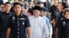 Malaysia charges 22 people linked to Islamic firm GISB with organized crime