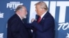 (FILES) Former US President and Republican presidential candidate Donald Trump and Mike Huckabee shake hands after taking part in a roundtable discussion hosted by Building America’s Future in Drexel Hill, Pennsylvania, on October 29, 2024.