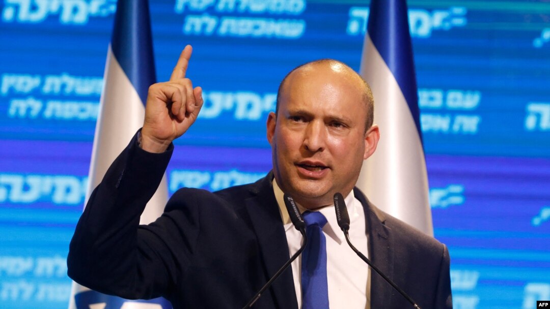 FILE - Naftali Bennett, leader of Israel's Yamina (New Right) party, addresses supporters at his party's campaign headquarters in the Mediterranean coastal city of Tel Aviv, March 24, 2021.