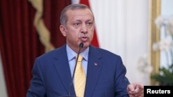 FILE - Turkey's President Recep Tayyip Erdogan speaks at a joint media briefing with Indonesia's President Joko Widodo at the presidential palace in Jakarta, Indonesia, July 31, 2015.