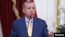 Turkey's President Recep Tayyip Erdogan speaks at a joint media briefing with Indonesia's President Joko Widodo at the presidential palace in Jakarta, Indonesia, July 31, 2015.