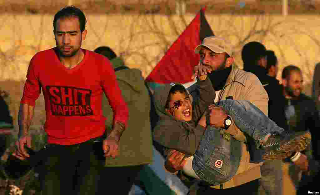 Wounded Palestinian boy Mohammad An-Najjar, 12, is evacuated during a protest at the Israel-Gaza border fence, in the southern Gaza Strip, Jan. 11, 2019.