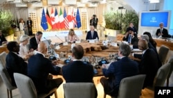 (FILE) U.S. President Joe Biden, President of the World Bank Ajay Banga, and Italy's Prime Minister Giorgia Meloni during the G7 Summit in Italy on June 13, 2024. 