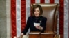 House Speaker Nancy Pelosi of Calif., readies to strike the gavel as she announces the passage of article II of impeachment against President Donald Trump, Dec. 18, 2019, on Capitol Hill in Washington.