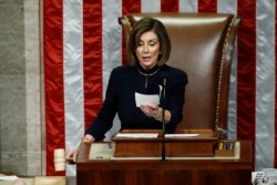 FILE - House Speaker Nancy Pelosi of Calif., readies to strike the gavel as she announces the passage of article II of impeachment against President Donald Trump, Dec. 18, 2019, on Capitol Hill in Washington.