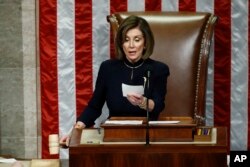 FILE - House Speaker Nancy Pelosi of Calif., readies to strike the gavel as she announces the passage of article II of impeachment against President Donald Trump, Dec. 18, 2019, on Capitol Hill in Washington.