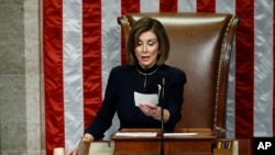 House Speaker Nancy Pelosi of Calif., readies to strike the gavel as she announces the passage of article II of impeachment against President Donald Trump, Dec. 18, 2019, on Capitol Hill in Washington.