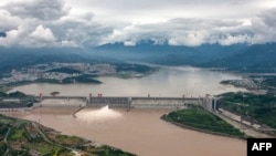 FILE - Water is released from the Three Gorges Dam, a hydropower project on the Yangtze River, in Yichang, central China's Hubei province, Sept. 7, 2020.