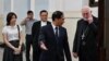 Vietnamese Foreign Minister Bui Thanh Son, second from right, welcomes the Vatican's foreign minister, Paul Gallagher, right, at the Foreign Ministry in Hanoi on April 9, 2024.