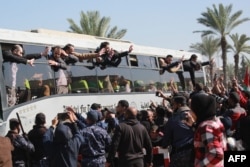 Crowds welcome former Palestinian prisoners as they arrive in Khan Younis in the southern Gaza Strip, Feb. 15, 2025.