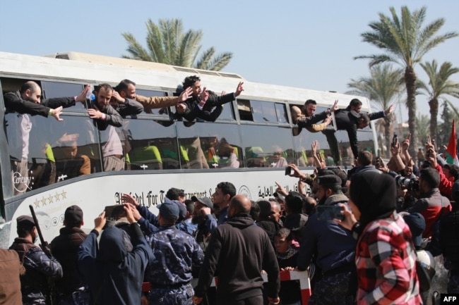 Crowds welcome former Palestinian prisoners as they arrive in Khan Younis in the southern Gaza Strip, Feb. 15, 2025.