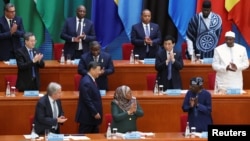 FILE - Chinese President Xi Jinping returns to his seat after delivering his keynote speech at the opening ceremony of the ninth Forum on China-Africa Cooperation Summit, at the Great Hall of the People in Beijing, Sept. 5, 2024. 