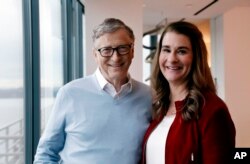 FILE - Bill and Melinda Gates pose for a photo in Kirkland, Wash., Feb. 1, 2019.