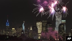 Fireworks go off in New York Harbor to celebrate the 125th birthday of the Statue of Liberty, October 28, 2011.