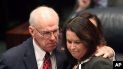 FILE - Sen. Alan Hays, R-Umatilla, left, congratulates Sen. Kelli Stargel, R-Lakeland, after Stargel's bill to limit abortions in Florida passed the Senate in Tallahassee, Fla., March 9, 2016.