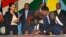 FILE - South Sudan President Salva Kiir, seated, signs a peace deal as Kenya’s President Uhuru Kenyatta, center-left, Ethiopia’s Prime Minister Hailemariam Desalegn, center-right, and Uganda’s President Yoweri Museveni, right, look on in Juba, South Sudan, Aug. 26, 2015. President Salva Kiir and his former vice president and rebel leader Riek Machar failed to form a unity transitional government on Jan. 23, 2016.