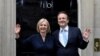英国新首相利兹∙特拉斯(Liz Truss)同她丈夫休·奥利瑞2022年9月6号在唐宁街10号门口向人们招手致意。
