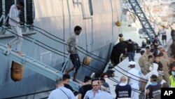 Migrants disembark in the port of Salerno, southern Italy, after being rescued at sea by the German ship Holstein, June 22, 2015. 