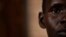 FILE -  a South Sudanese refugee and 32-year-old mother, who was raped for several days by a group of soldiers before she was allowed to leave, stands by a window at a women's center.