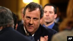 In this Tuesday, Jan. 14, 2014 file photo, New Jersey Gov. Chris Christie arrives to deliver his State Of The State address at the Statehouse in Trenton, N.J.