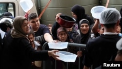 Displaced radical   queue for nutrient  cooked by a foundation  kitchen, amid ongoing hostilities betwixt  Hezbollah and Israeli forces, successful  downtown Beirut, Lebanon, Oct. 10, 2024.