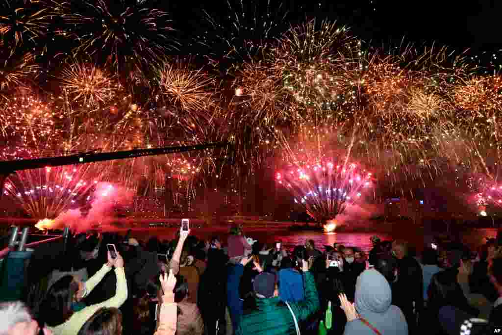 People celebrate in Brisbane, Australia, following an announcement by the International Olympic Committee that Brisbane was picked to host the 2032 Olympics.