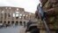 An Italian soldier patrols near Rome's Colosseum. Milan's cathedral and La Scala opera house, as well as "general venues" like churches, synagogues, restaurants, theaters and hotels have been identified as "potential targets" in those two cities for terrorist attacks.