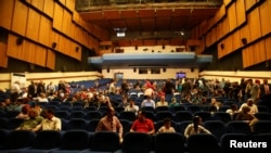 People watch 'Letters from Baghdad,' a documentary about Gertrude Bell, for the first time in Iraq at the National Theater of Baghdad, Iraq April 2, 2018. 