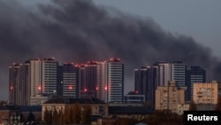 Smoke rises in the sky over the city after a Russian drone strike, amid Russia's attack on Ukraine, in Kyiv, Ukraine, November 7, 2024. 