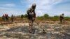 FILE - Soldiers detect Unexploded Ordnance and defoliant Agent Orange during the launch of the &quot;environmental remediation of dioxin contamination&quot; project, in Da Nang City, Vietnam.