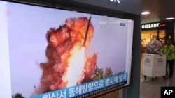 A TV screen shows a file image of a North Korea's missile launch during a news program at the Seoul Railway Station in Seoul, South Korea, Oct. 2, 2019. 