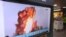 A TV screen shows a file image of a North Korea's missile launch during a news program at the Seoul Railway Station in Seoul, South Korea, Oct. 2, 2019. 