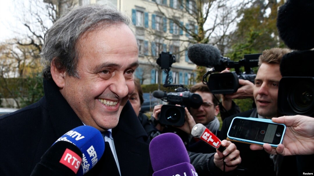 FILE - UEFA President Michel Platini smiles as he arrives for a hearing at the Court of Arbitration for Sport (CAS) in Lausanne, Switzerland, Dec. 8, 2015. 
