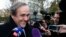 FILE - UEFA President Michel Platini smiles as he arrives for a hearing at the Court of Arbitration for Sport (CAS) in Lausanne, Switzerland, Dec. 8, 2015. 