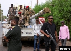 Sudan's military ruler General Abdel Fattah al-Burhan arrives to the city of Port Sudan on his first trip away following the crisis in Sudan's capital Khartoum, Aug. 27, 2023.