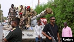 Sudan's military ruler Burhan arrives to the city of Port Sudan on his first trip away following the crisis in Sudan capital Khartoum