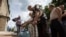 Residents collect water at a pumping station in the eastern Ukranian city of Slaviansk, June 17, 2014. Slaviansk, the pro-Russian separatist stronghold, is faced with ongoing shortages, utility outages and frequent artillery fire. 