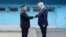 FILE - U.S. President Donald Trump shakes hands with North Korean leader Kim Jong Un as they meet at the demilitarized zone separating the two Koreas, in Panmunjom, South Korea, June 30, 2019. 