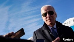 U.S. President Joe Biden speaks to reporters after disembarking from Air Force One en route to Camp David at Hagerstown Regional Airport, Hagerstown, Maryland