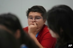 Francisco Vera Manzanares, 15, a climate activist from Colombia, listens during a forum with young activists, Nov. 12, 2024, at the COP29 U.N. Climate Summit in Baku, Azerbaijan.