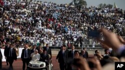 Pope Francis arrives for Mass in a golf cart at Venustiano Carranza stadium in Morelia, Mexico, Tuesday, Feb. 16, 2016.