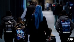 This handout photo taken on Jan. 6, 2025 and received from the U.S. embassy in Manila shows Afghans, whose U.S. Special Immigrant Visa will be processed, arriving at an airport terminal on the Philippines' Luzon island.