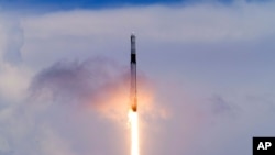 A SpaceX Falcon 9 rocket with a Dragon 2 spacecraft lifts off on Pad 39A at the Kennedy Space Center for a re-supply mission to the International Space Station from Cape Canaveral, Fla., Thursday, June 3, 2021. (AP Photo/John Raoux)