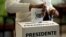 A voter casts his ballot during the presidential election at a polling station in San Jose, Costa Rica, Feb. 4, 2018. 