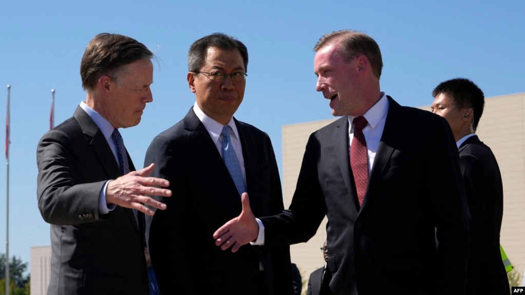 US National Security Advisor Jake Sullivan is welcomed by Yang Tao, center, from China's foreign ministry and U.S. Ambassador to China Nicholas Burns upon arriving at the Beijing Capital International Airport in Beijing on Aug. 27, 2024.