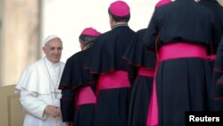 Pope Francis is greeted by bishops during his general audience in St Peter's Square at the Vatican, May 8, 2013. 