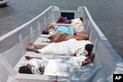 Bodies of migrants who died in a boat tragedy are seen on the shore of the Madagascar coast in the Indian Ocean on Nov. 23, 2024.