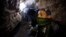 A Palestinian works inside a smuggling tunnel beneath the Egyptian-Gaza border, Feb. 19, 2013