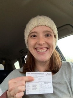 Molly Schuman holds her vaccination card. (Photo: courtesy Molly Schuman)