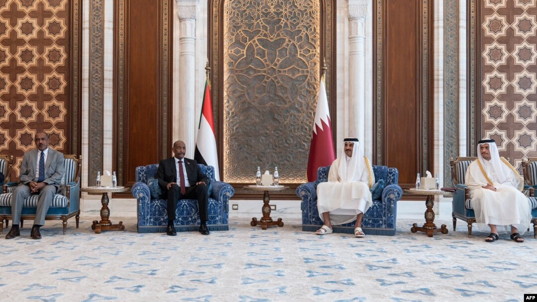 Qatar's Amiri Diwan shows Qatar's Emir Sheikh Tamim bin Hamad al-Thani meets Sudan's army chief Gen. Abdel Fattah al-Burhan in Doha, Sept. 7, 2023.